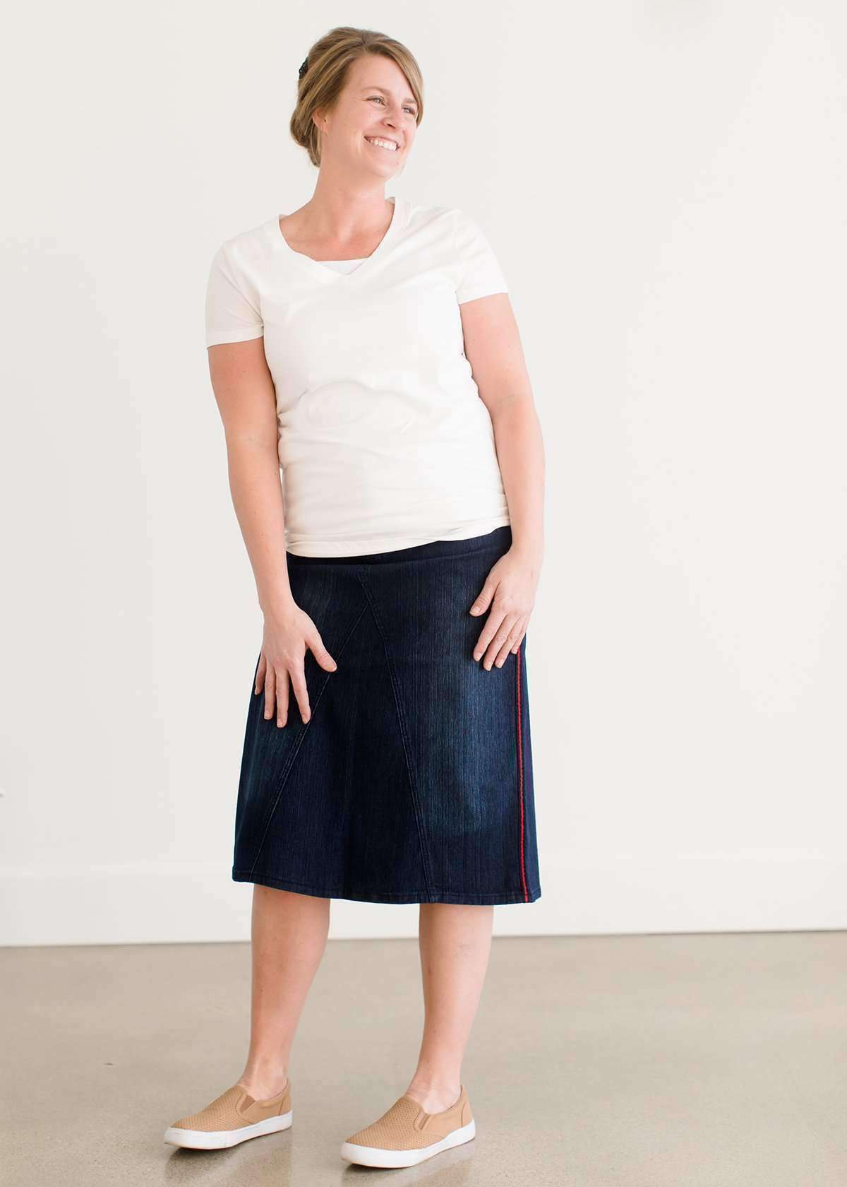 Woman wearing a modest style knee length denim skirt