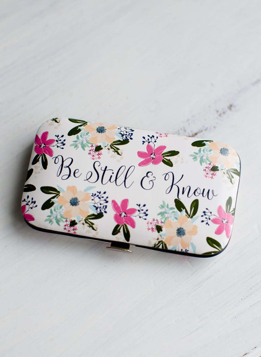 Floral padded manicure case that says be still in know.