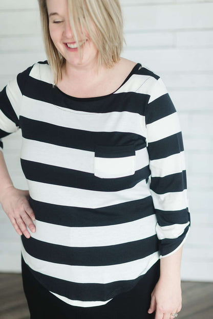 Modest black and white stripe, three quarter length sleeve with front pocket.