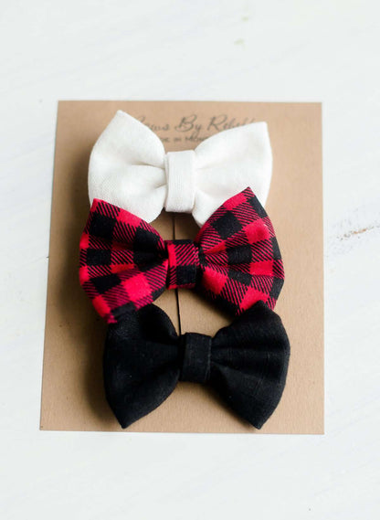 Buffalo check headbands that are white, red and black. Nylon headband or a alligator style clip.