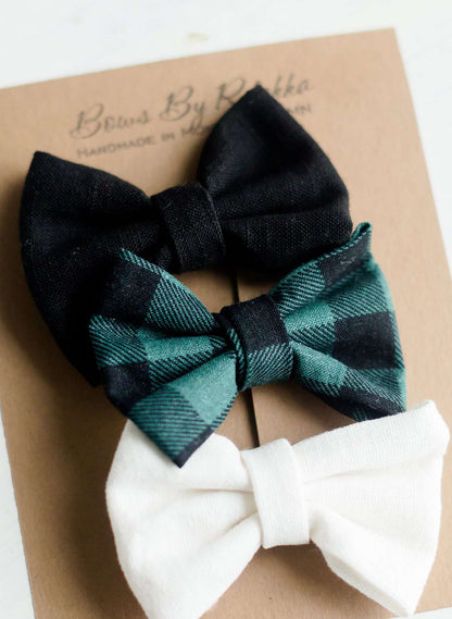 Little girls hair bow set of three. This shows a white, black and green buffalo check headband or alligator clip bow.