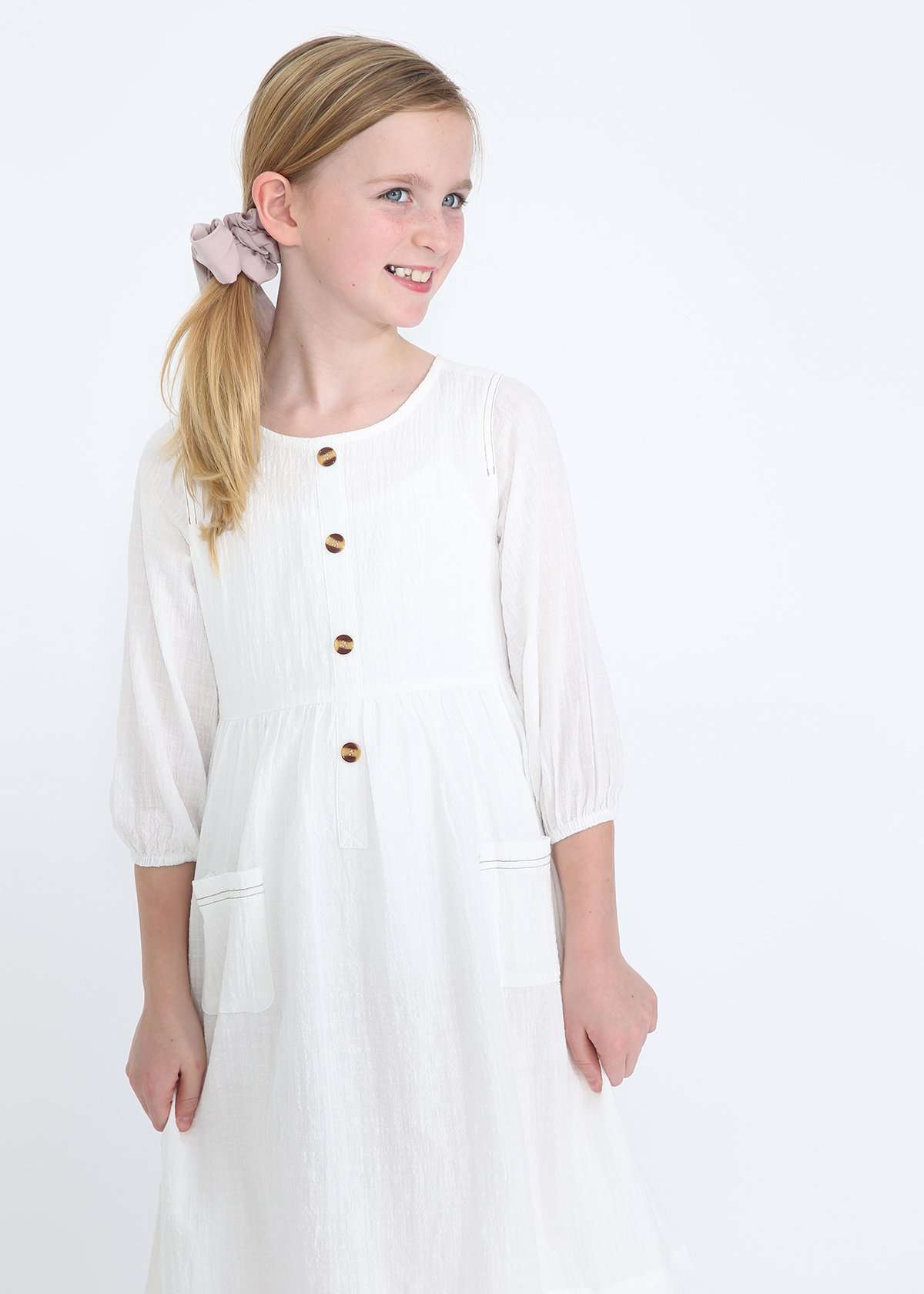 modest girls white peasant dress with pockets and buttons