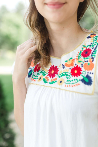 This is a modest ruffle sleeve green, red, blue embroidered top