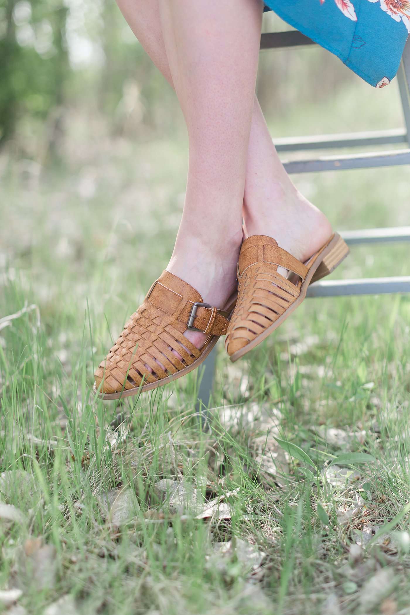 genuine braided leather strappy front sandal with closed toe and open back. 1 inch heel and pretty buckle accent.