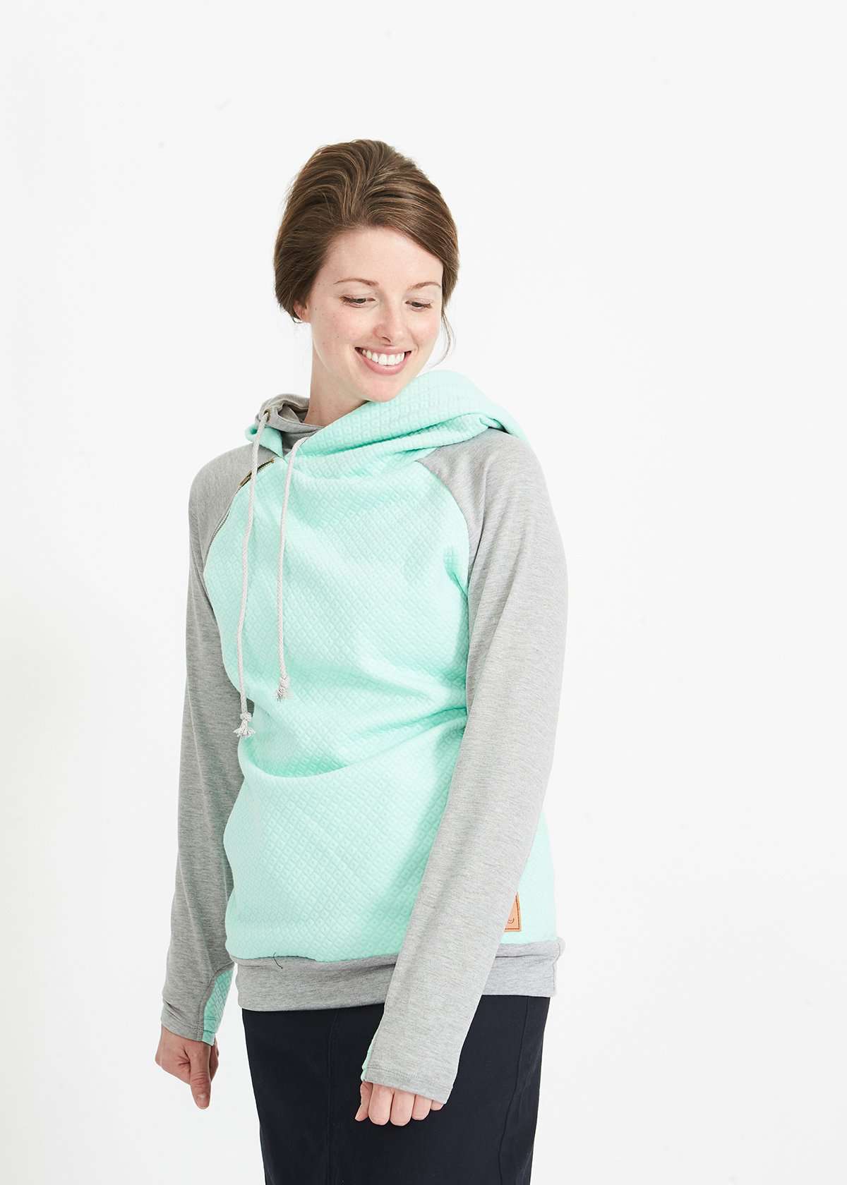 Woman wearing a mint and gray doublehood sweatshirt from ampersand avenue