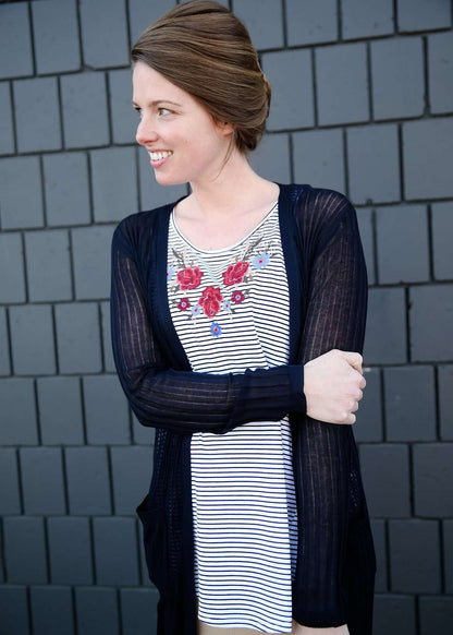 modest women wearing a black and white striped embroidered floral tank top