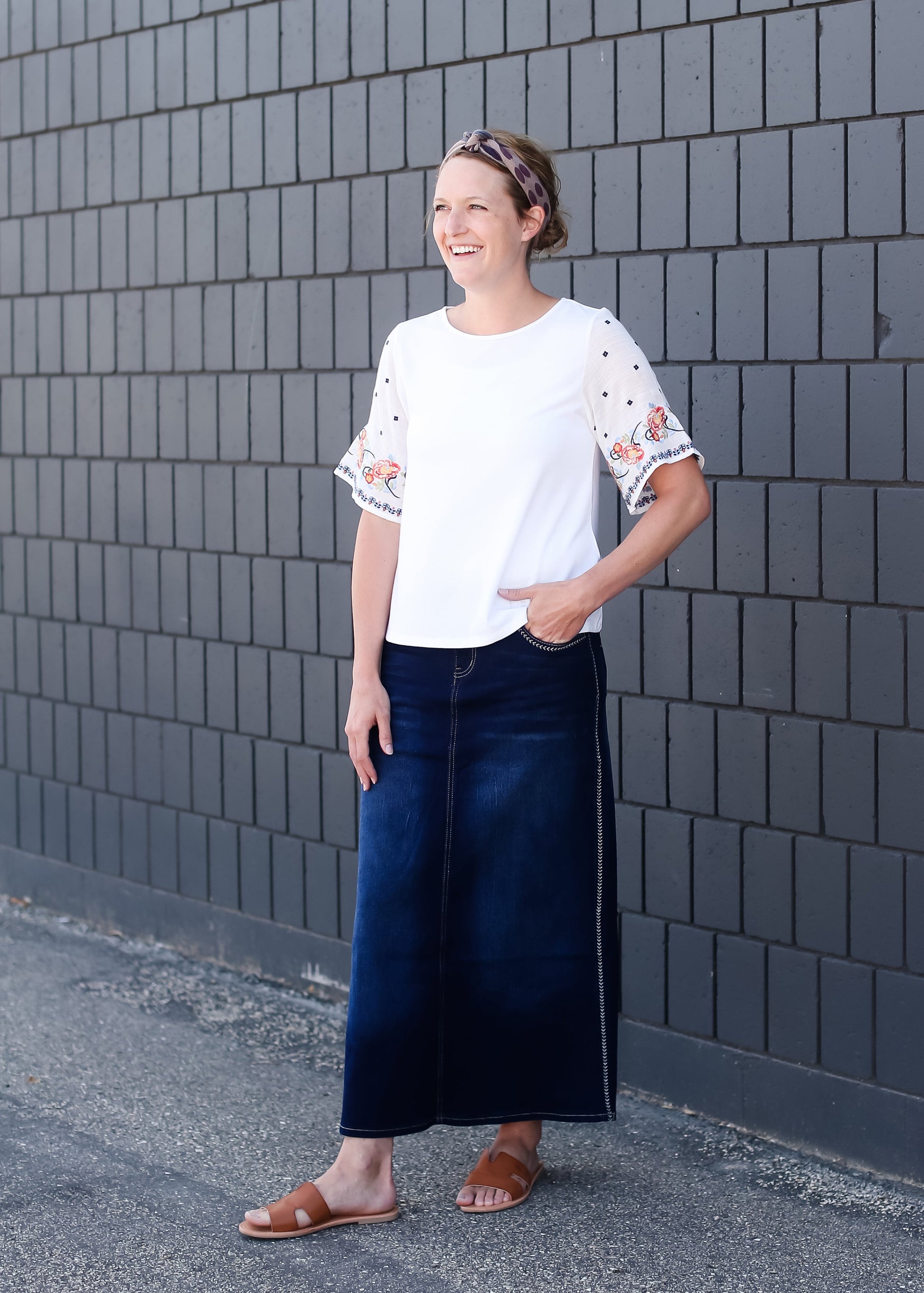 woman wearing a white embroidered top