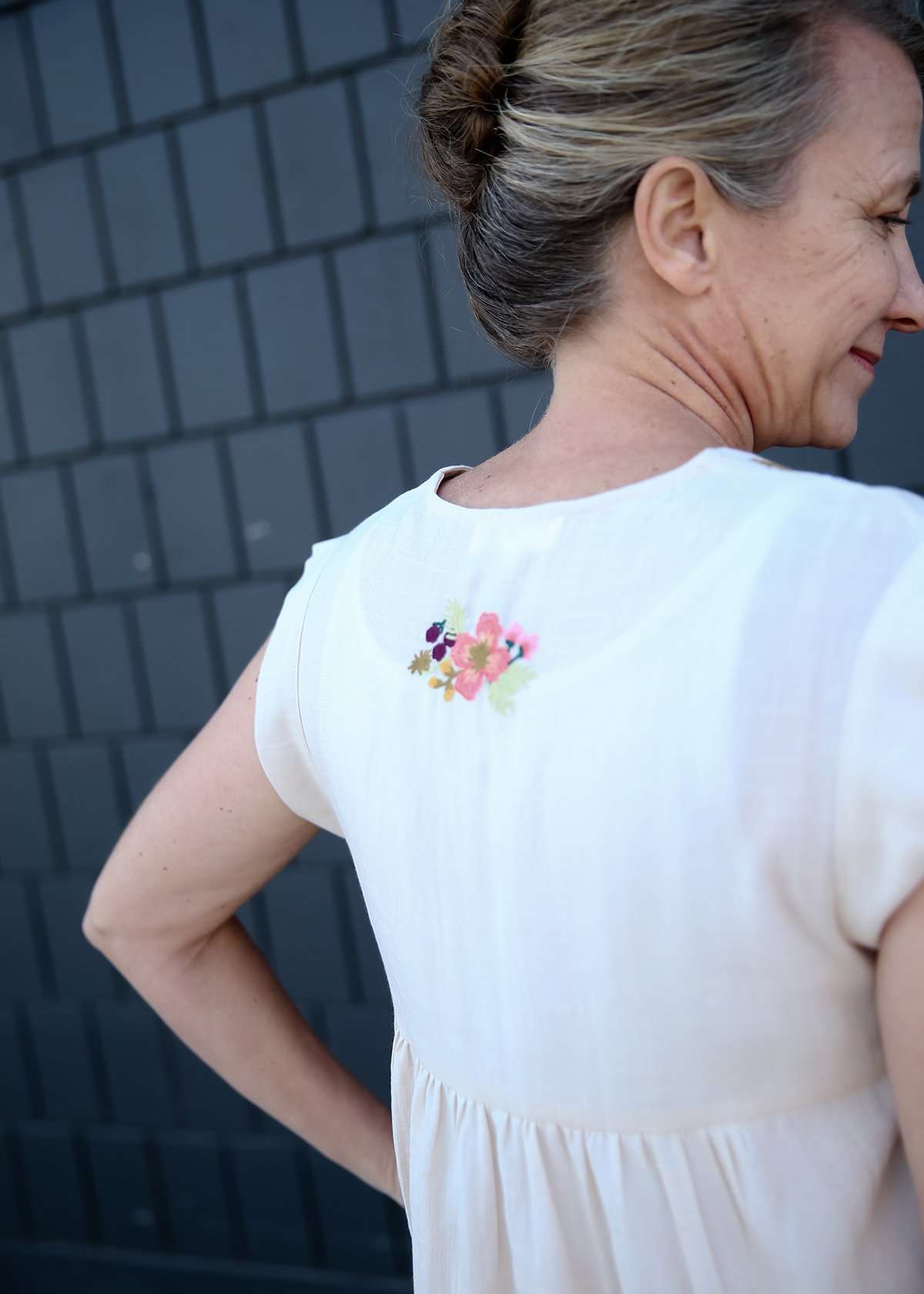 Floral embroidered smocked white top