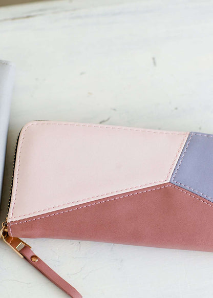 Geomeric Minimalist Wallet with zipper closure and bill divider. Black, white, peach, mauve and mint colors available.