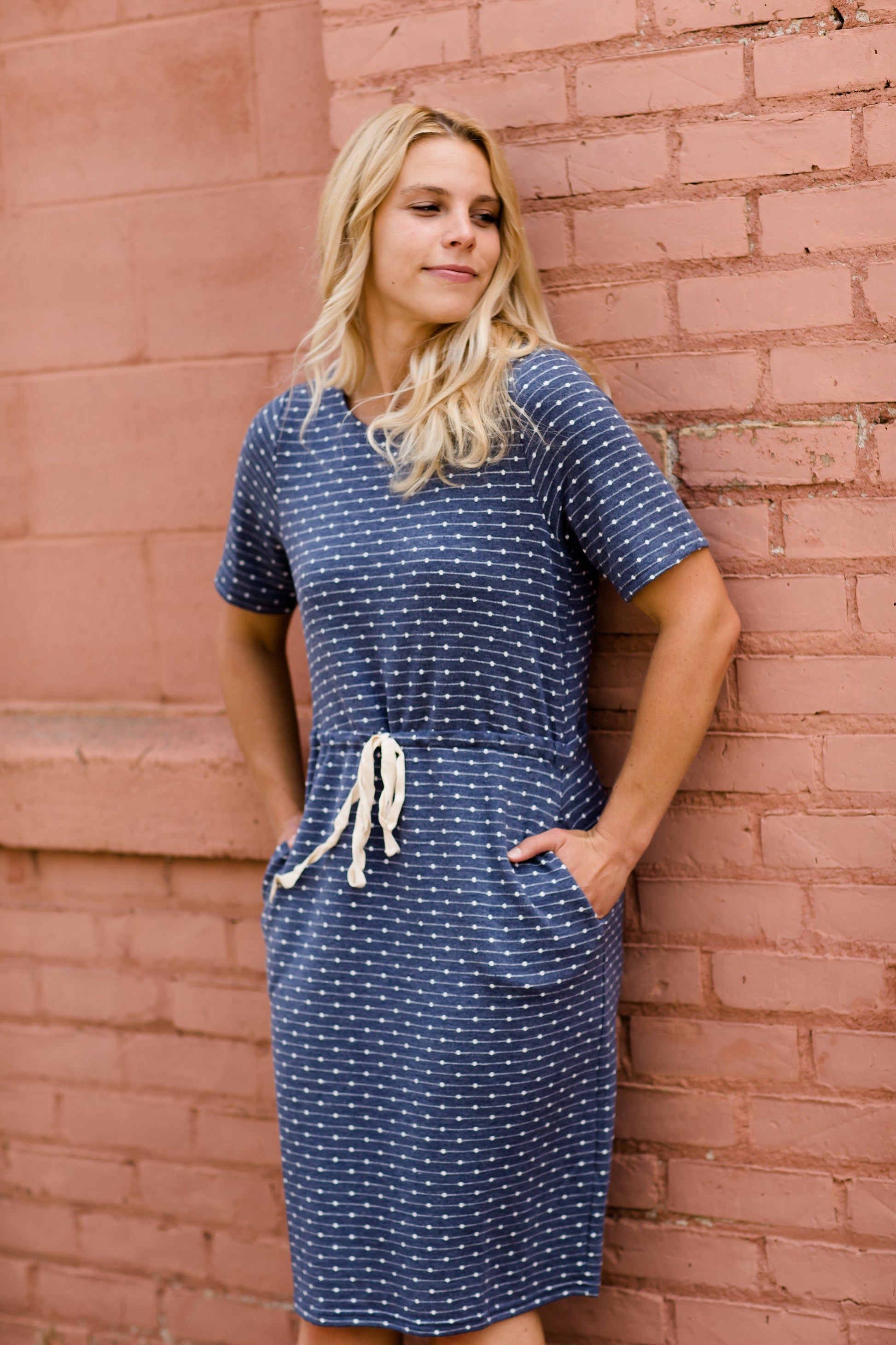 Navy dot knit midi dress with pockets and an adjustable waist