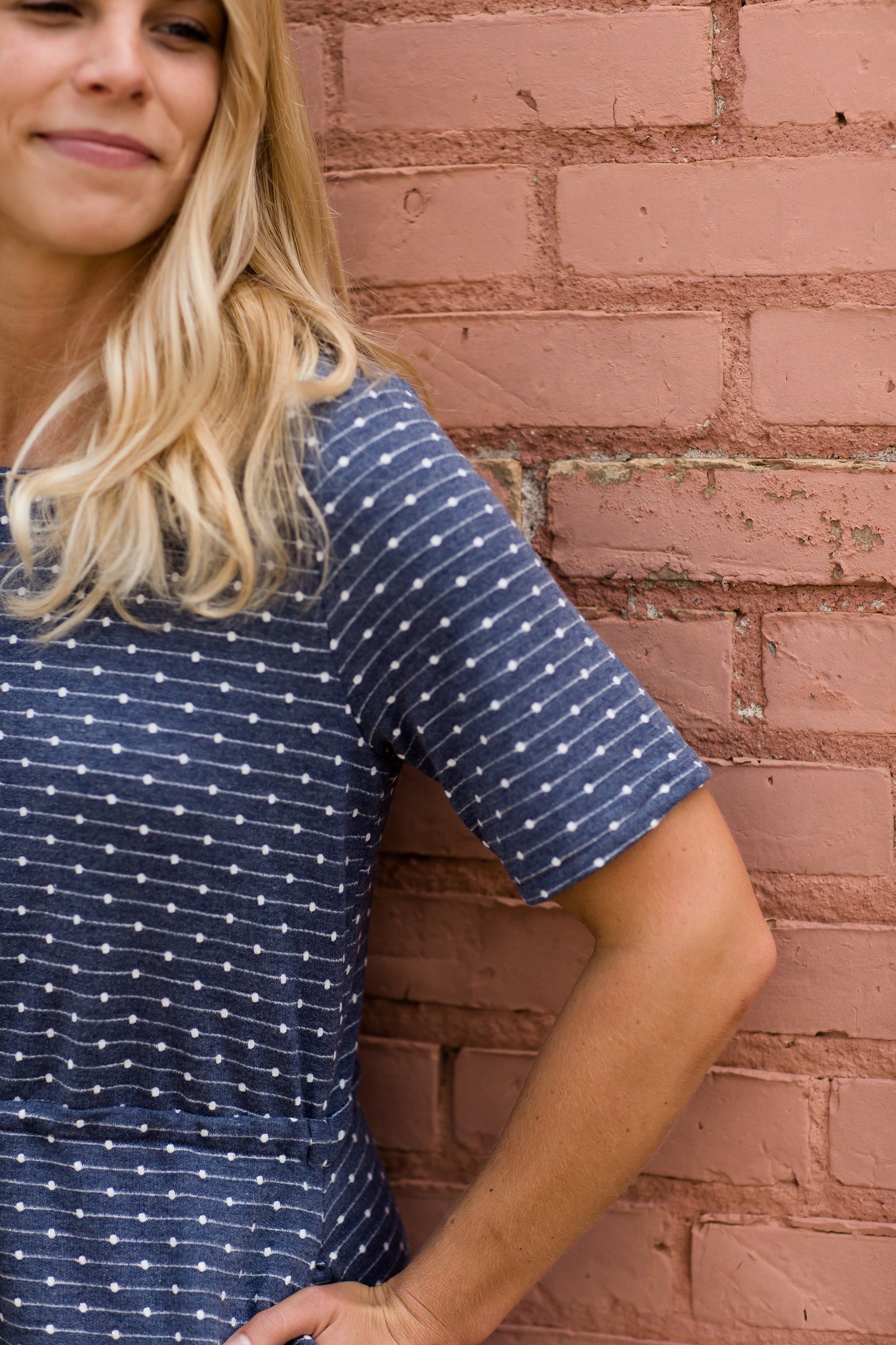 Navy dot knit midi dress with pockets and an adjustable waist