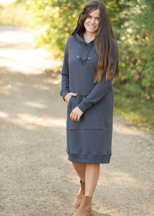 The Marti Sweatshirt Midi Dress is an Inherit Design we made for all your cozy activities! This dress will be great for snuggling up on the couch, heading out during cooler weather or paired with leggings for work! It is super fuzzy on the inside with an elevated, quality fabric on the outside with a kangaroo pocket. There are wide ribbed hems on the bottom and on the cuffs with thumb holes!