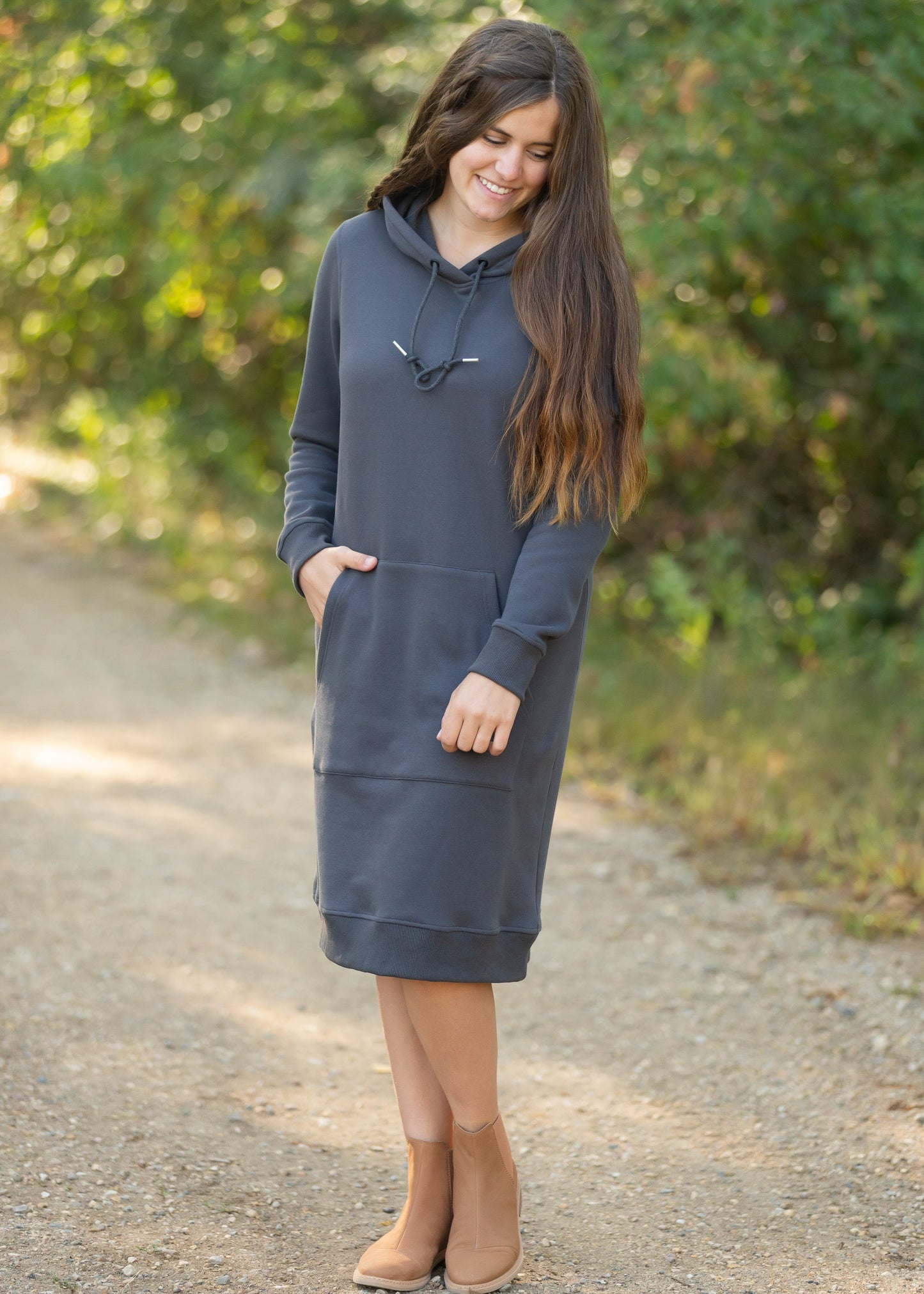 The Marti Sweatshirt Midi Dress is an Inherit Design we made for all your cozy activities! This dress will be great for snuggling up on the couch, heading out during cooler weather or paired with leggings for work! It is super fuzzy on the inside with an elevated, quality fabric on the outside with a kangaroo pocket. There are wide ribbed hems on the bottom and on the cuffs with thumb holes!