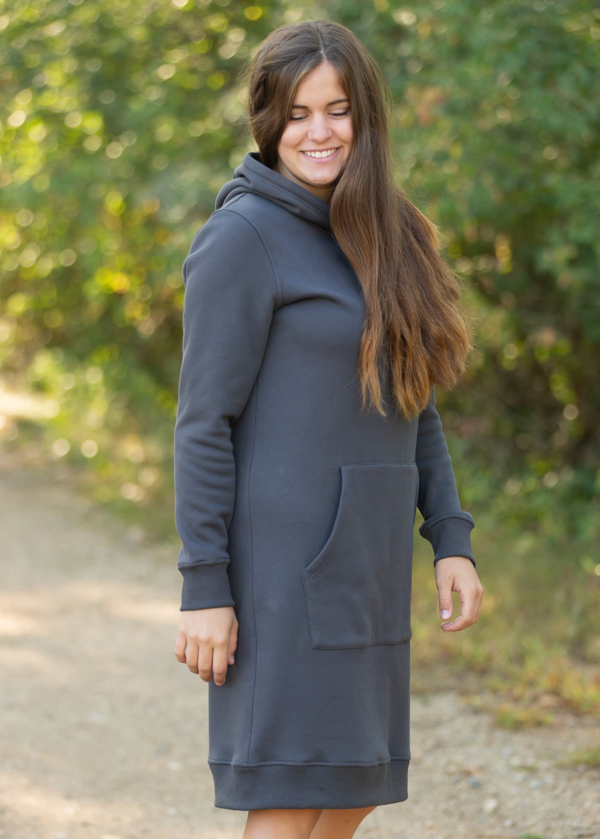 The Marti Sweatshirt Midi Dress is an Inherit Design we made for all your cozy activities! This dress will be great for snuggling up on the couch, heading out during cooler weather or paired with leggings for work! It is super fuzzy on the inside with an elevated, quality fabric on the outside with a kangaroo pocket. There are wide ribbed hems on the bottom and on the cuffs with thumb holes!