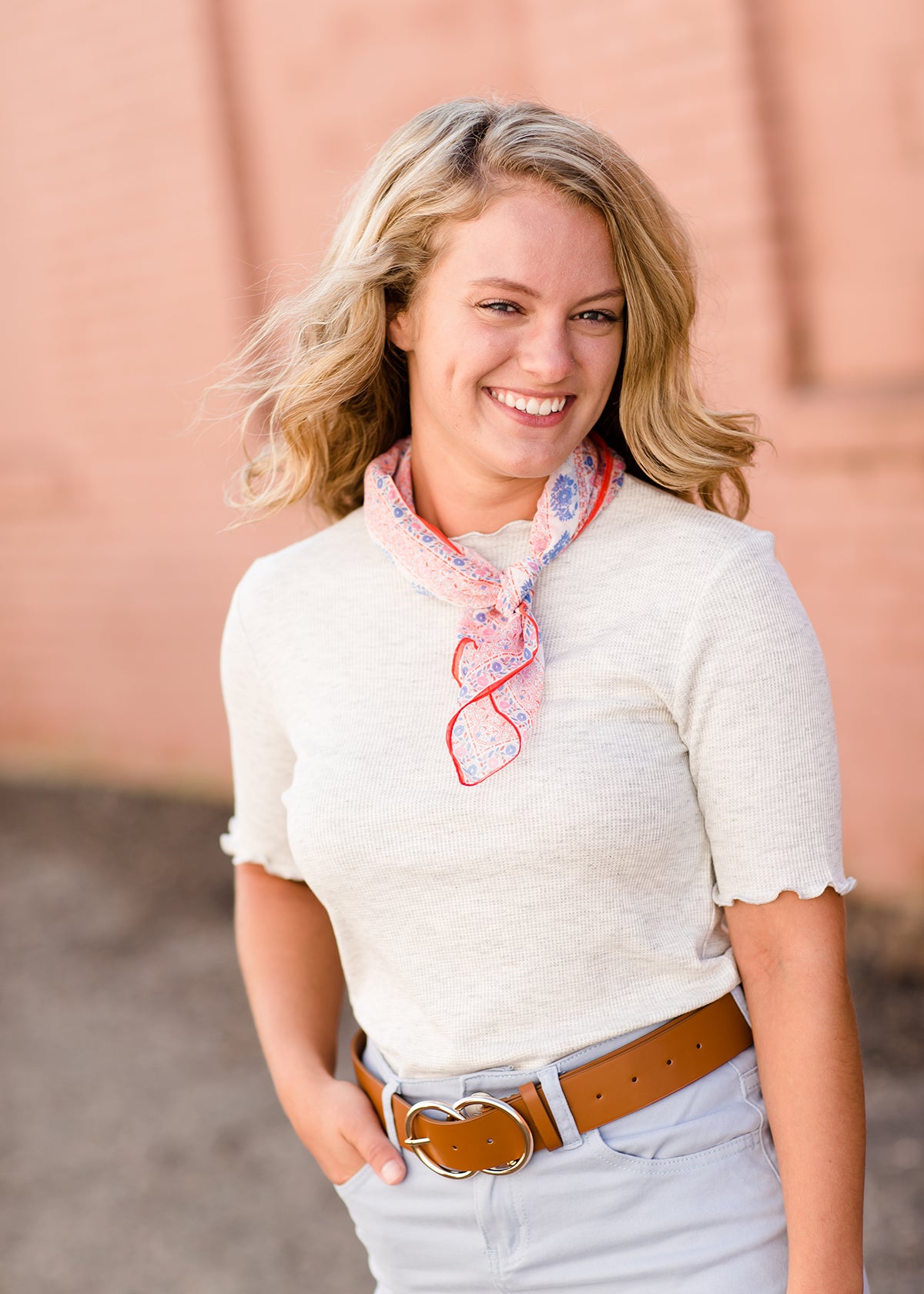 woman wearing a gray mock neck short sleeve top