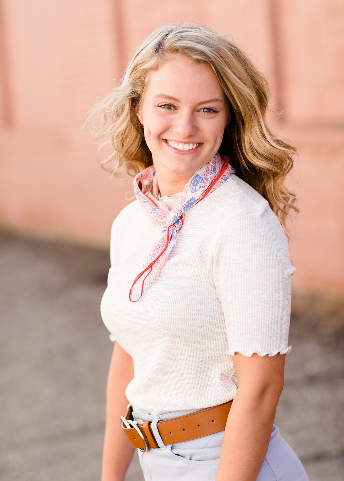 woman wearing a gray mock neck short sleeve top