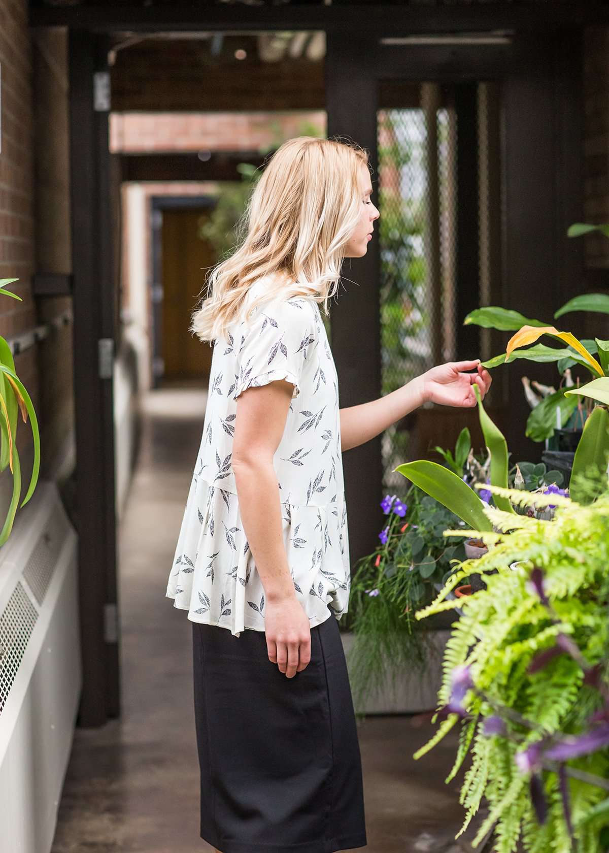 greenery patterned peplum white top with faux buttons on back