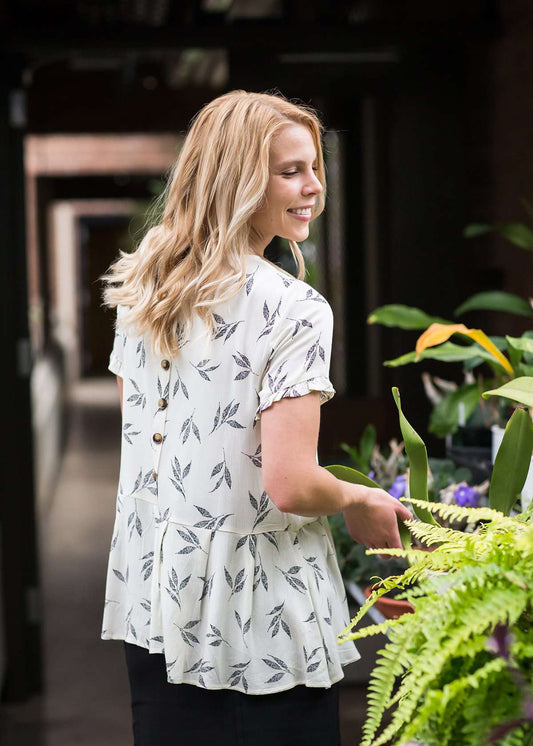 greenery patterned peplum white top with faux buttons on back