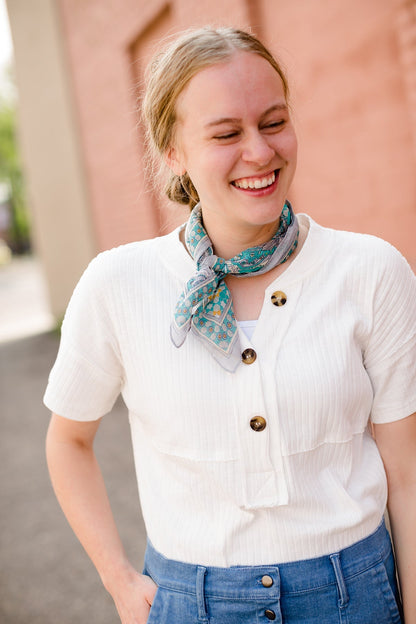 White modest v-neck button detail top